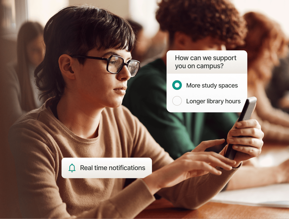 Student using Studo app on smartphone to view real-time notifications and feedback poll