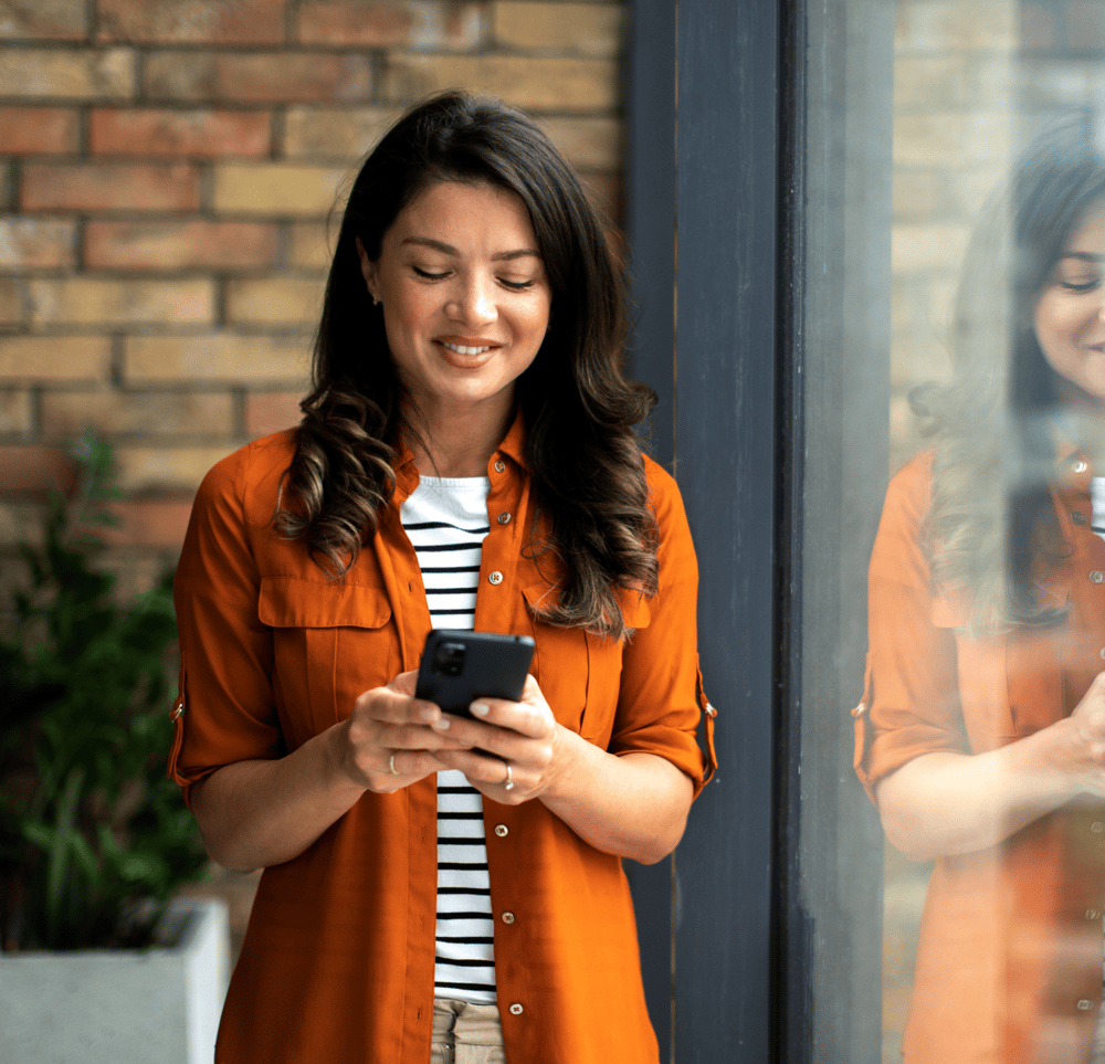 Student at home using a smartphone to give course feedback through the Studo Mobile Evaluation feature